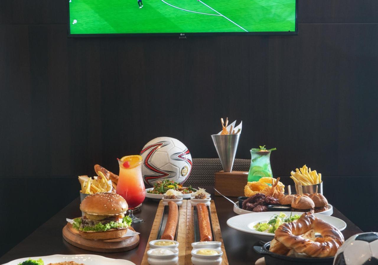 City Centre Rotana Doha Exterior photo A typical sports bar menu